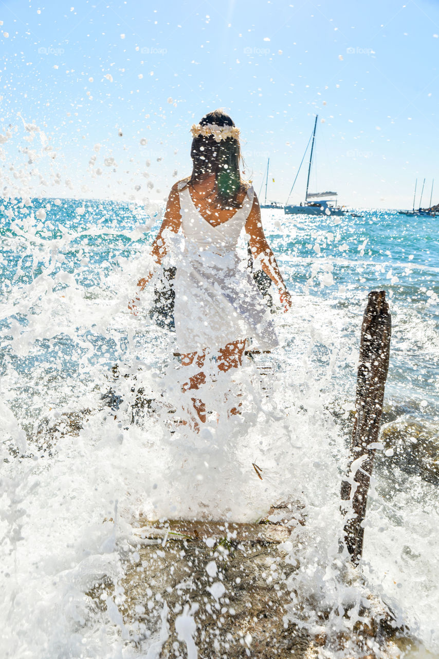 Woman standing in the water water splash