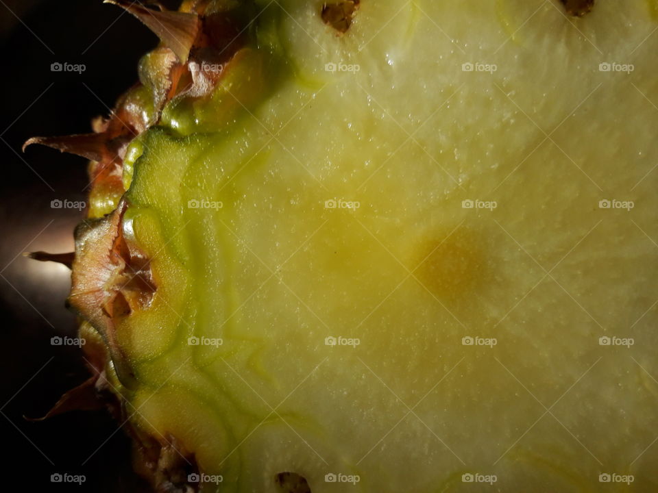 sliced intesrior eyes of the frightful spike pineapple fruit close up