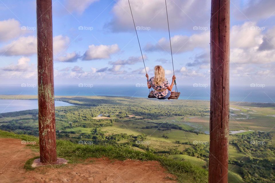 girl on a swing on the mountain