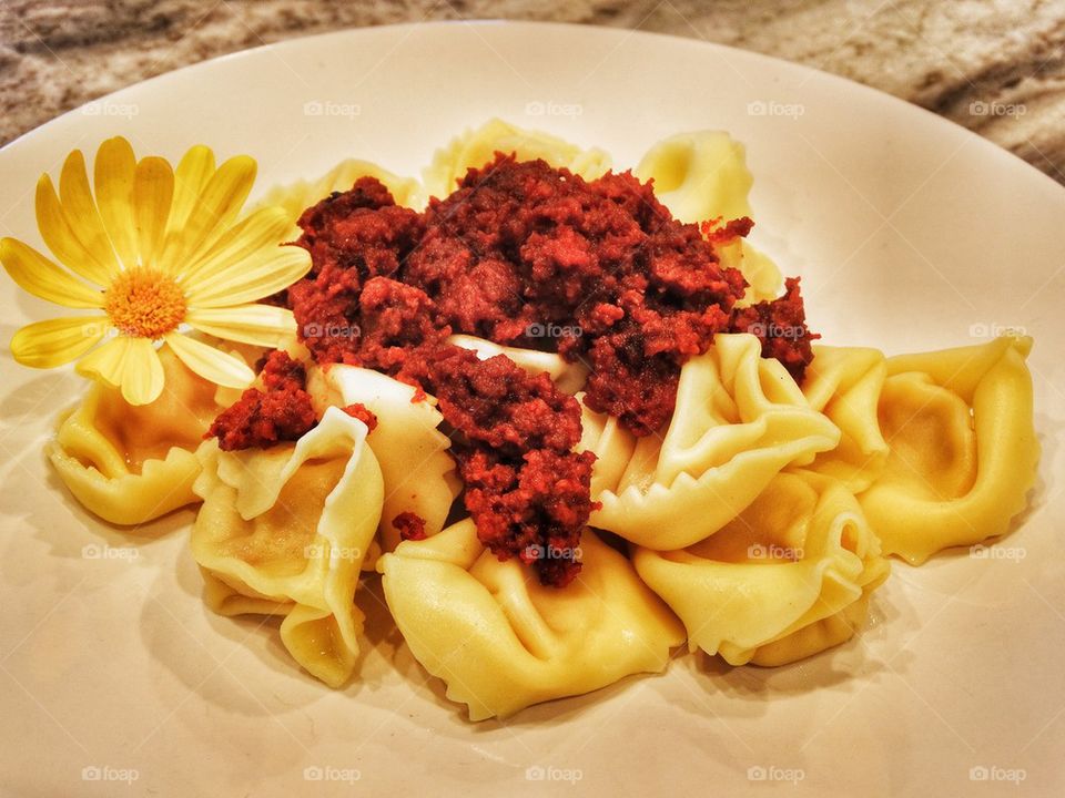 Tortellini And Sausage With Wildflower Garnish. Tortellini With Chorizo
