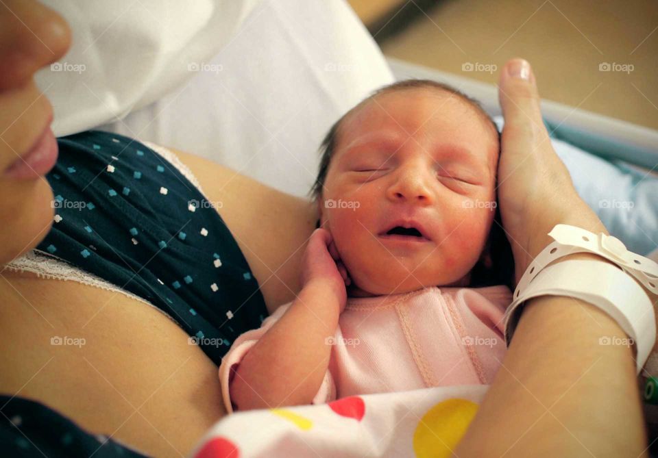 Mother holding her new born baby