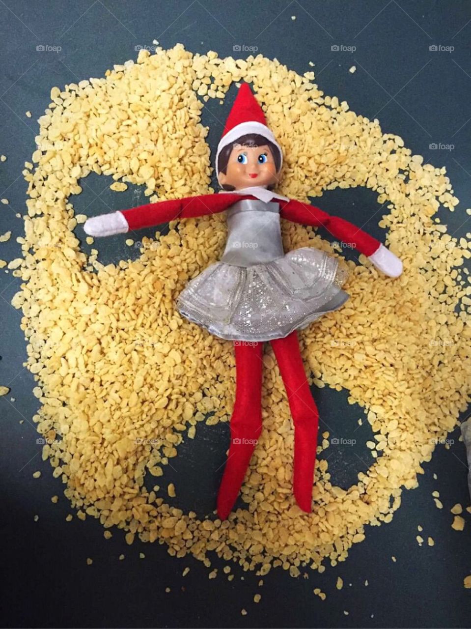 Our elf making a Rice Krispies Angel. 