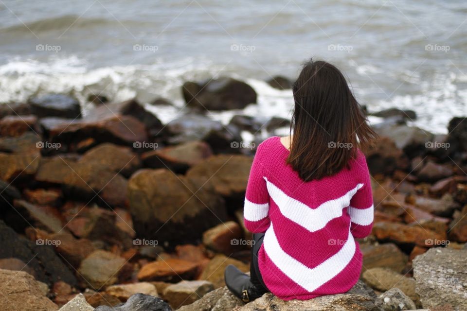 A girl watching the rocks