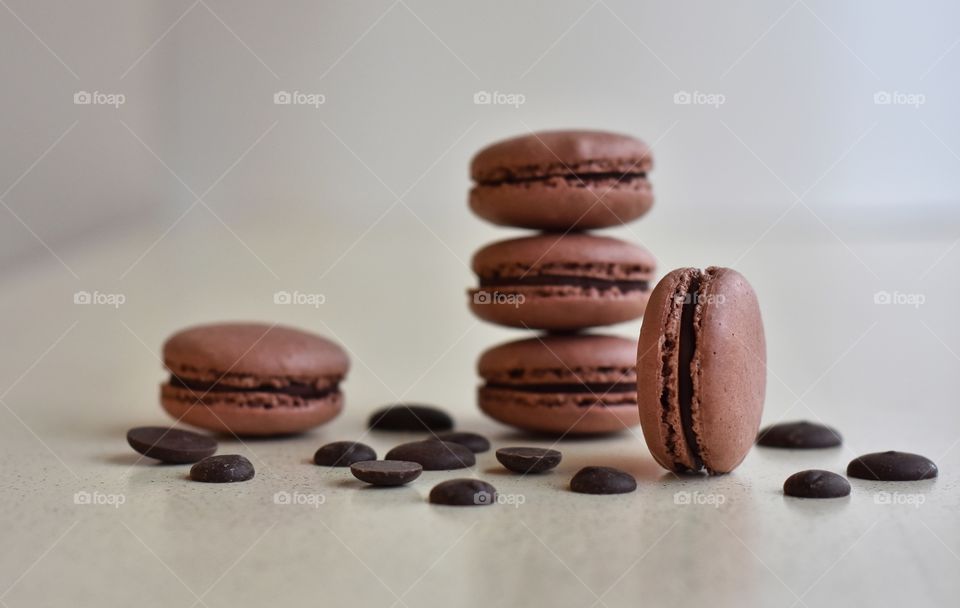 still life with chocolate macaroons and chocolate drops