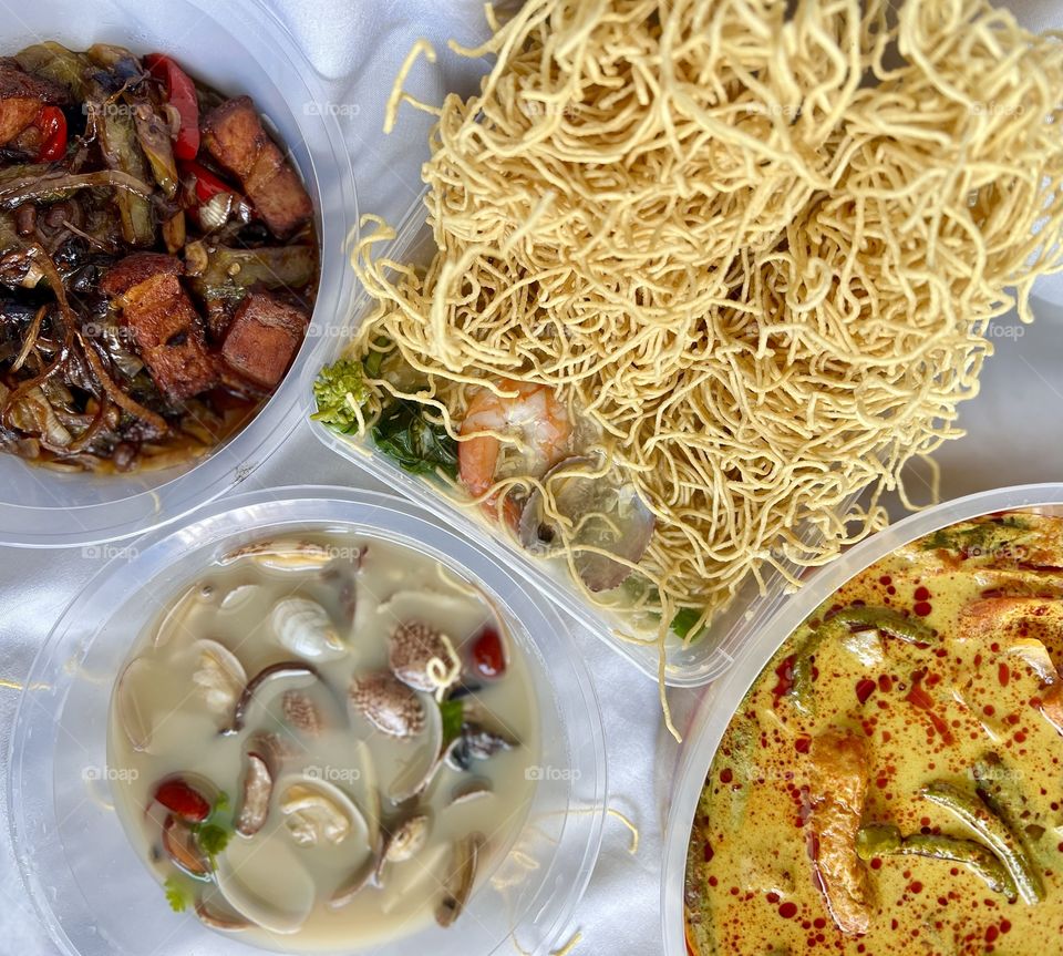 Asian food includes lala clam soup, curry fish head, bitter gourd pork and crispy twin tower noodles 