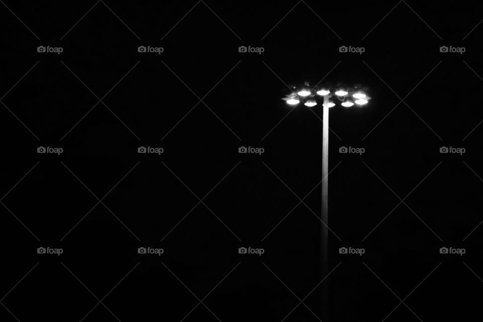 Brightly shining floodlight in the dark