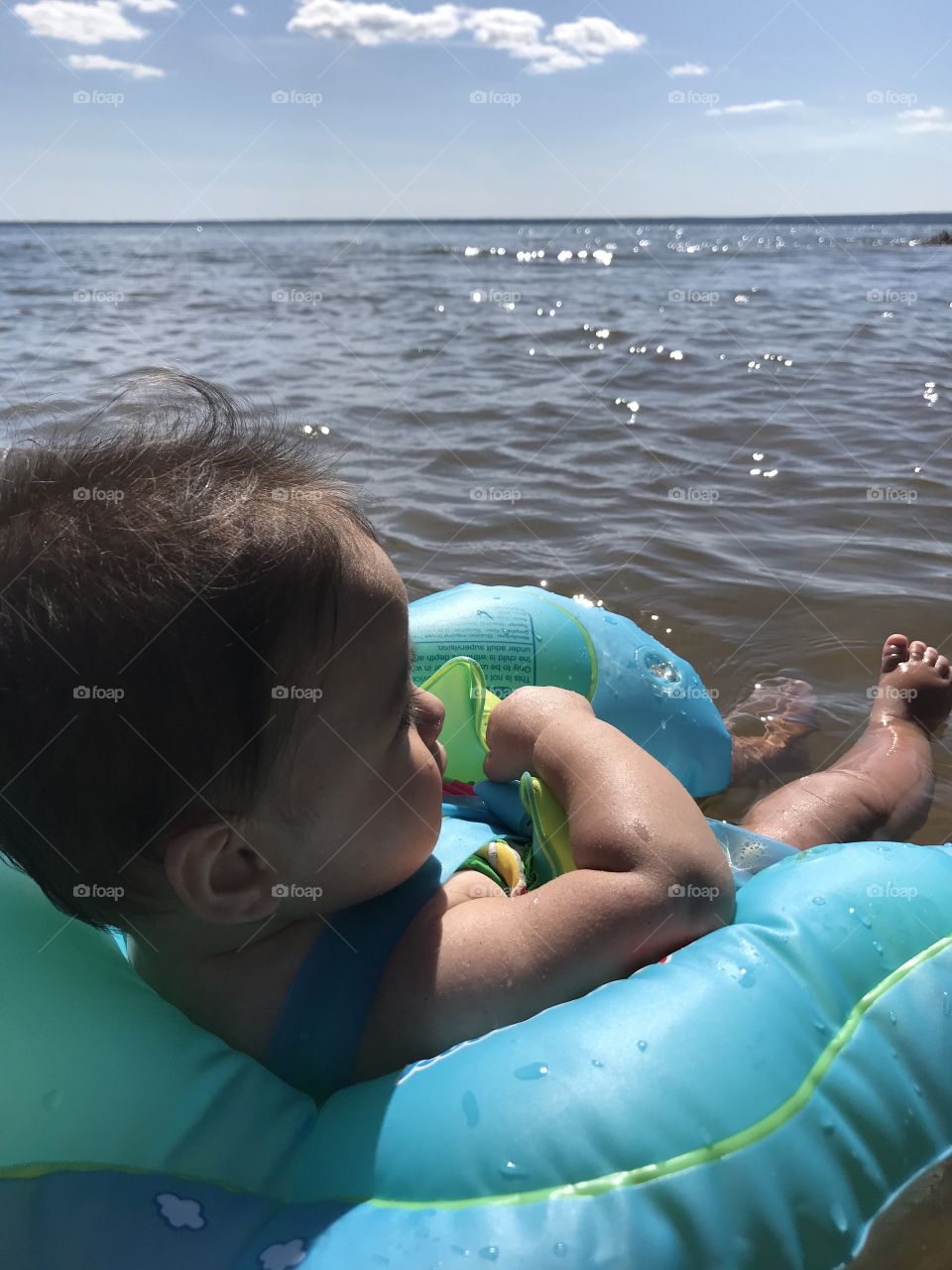 Baby floating in the water