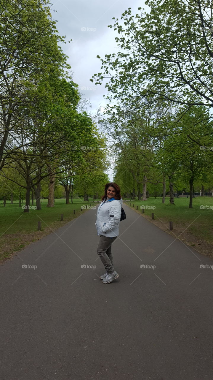 Woman posing on empty road