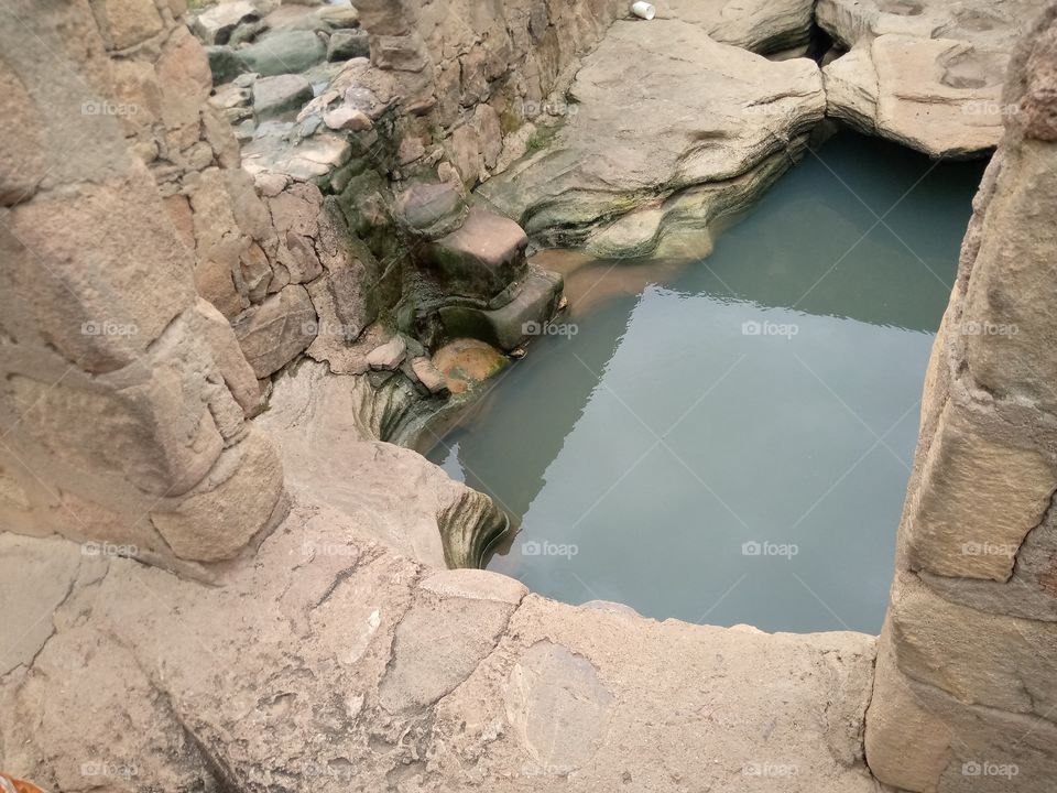 A spring at bobini village of guyuk local government of Adamawa, Nigeria. the spring served as a tourist site and the water really help the inhabitants of the place.