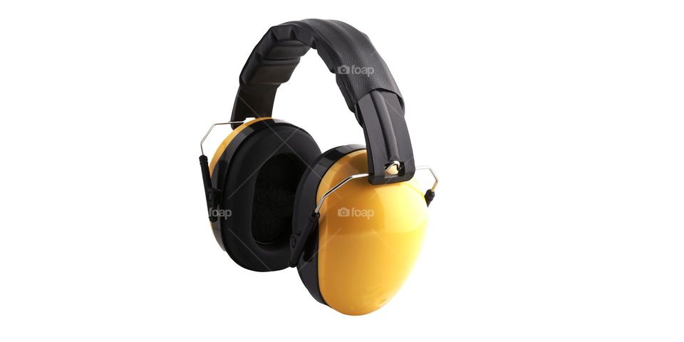 Photo of yellow earmuffs on a white background, the function of this tool is to prevent damage to the eardrum when working in a noisy place