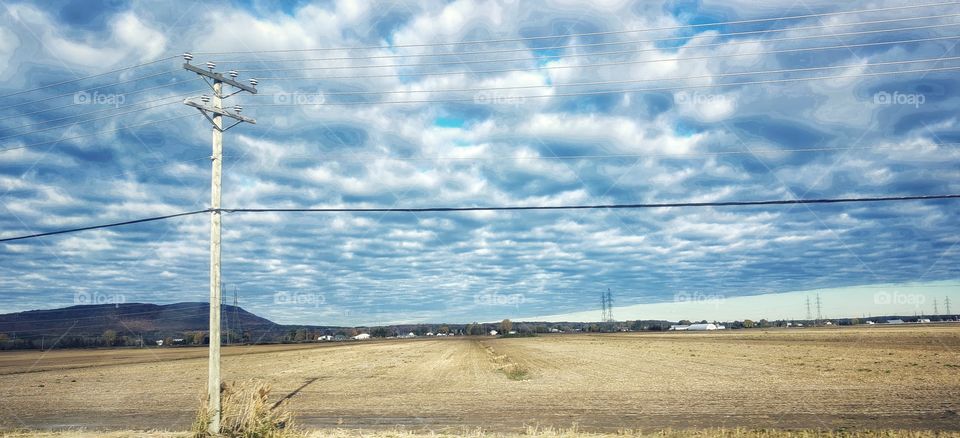 Autumn field and clouds