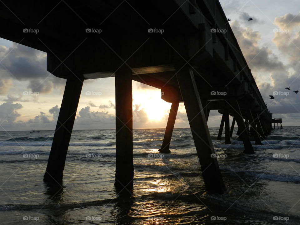 The Golden Hour. Sunrise by the pier