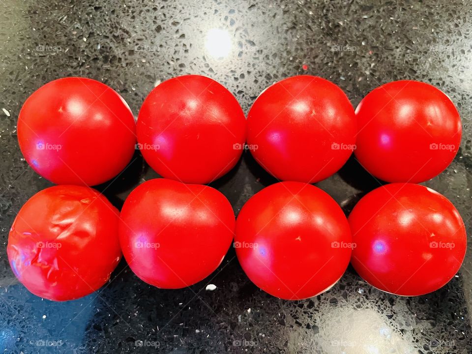 Cocktail Tomatoes, a smaller variety of tomato.  While tomatoes are fruits-botanically classified as berries-they are commonly used as a vegetable ingredient or side dish. 