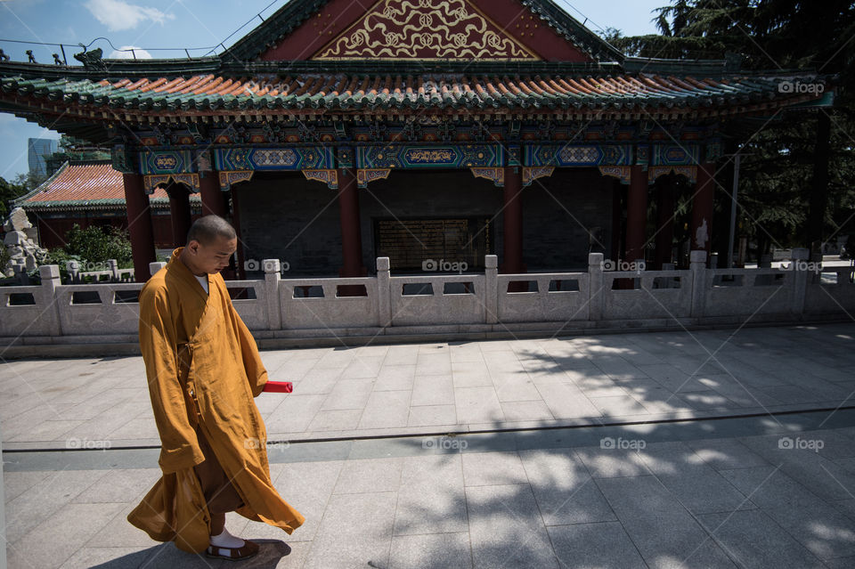 Asia, China, Beijing, Chinese Temple, monk walking