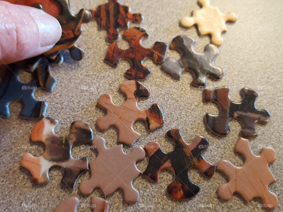 Man holding puzzle piece