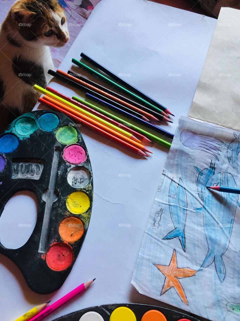 A little girl practicing her favorite hobby which is painting