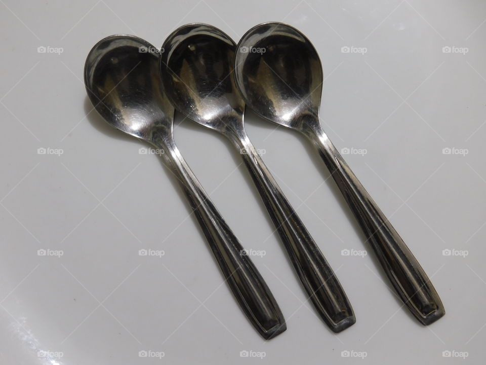 Table Spoons Arrangement on white background.