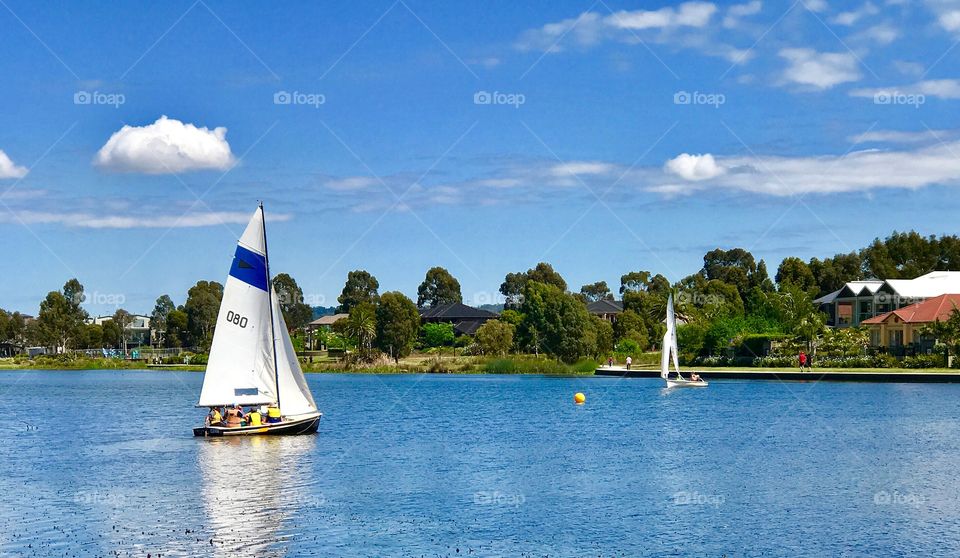Sunny Sunday morning teaching the children how to sail on the lake. 