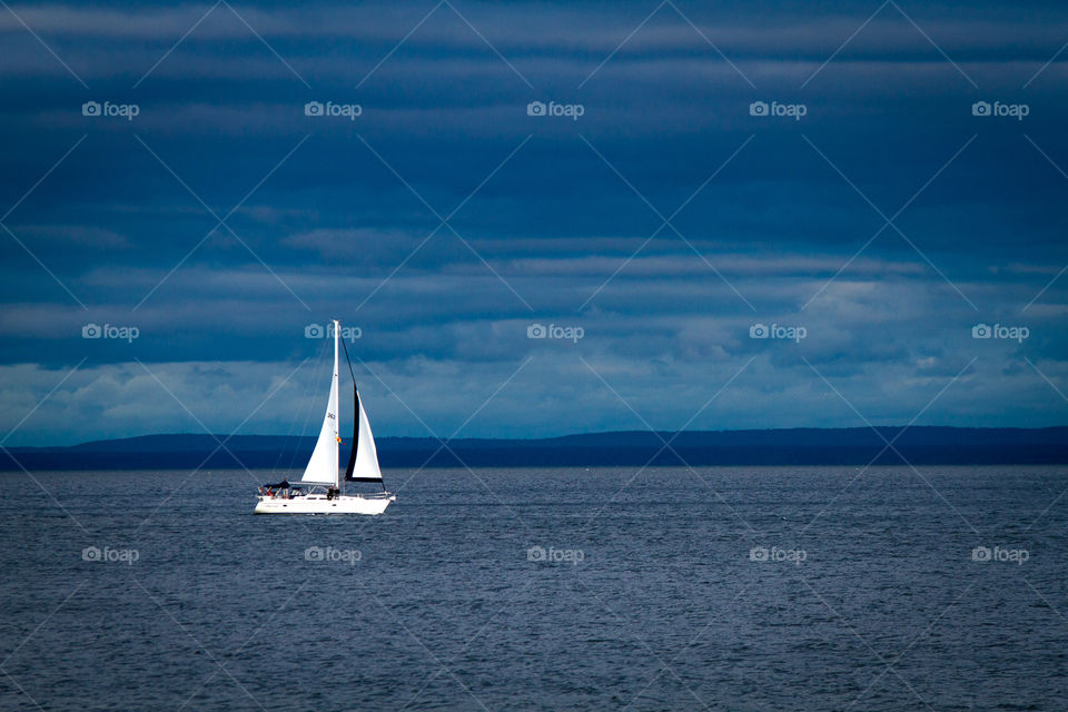 Sailing. Sailing on Lake Superior on an overcast day