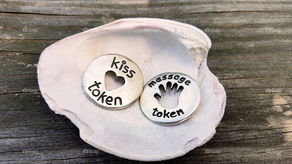 Tokens of affection. massage & kiss
kiss tokens in seashell
