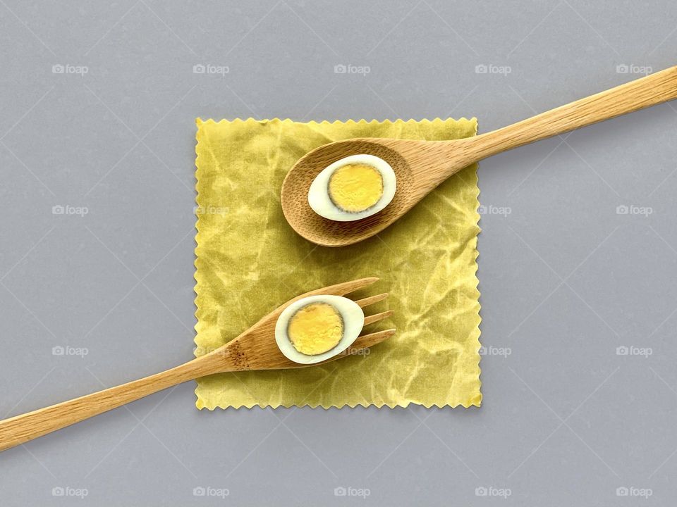 Eggs, wooden fork and spoon, healthy food 
