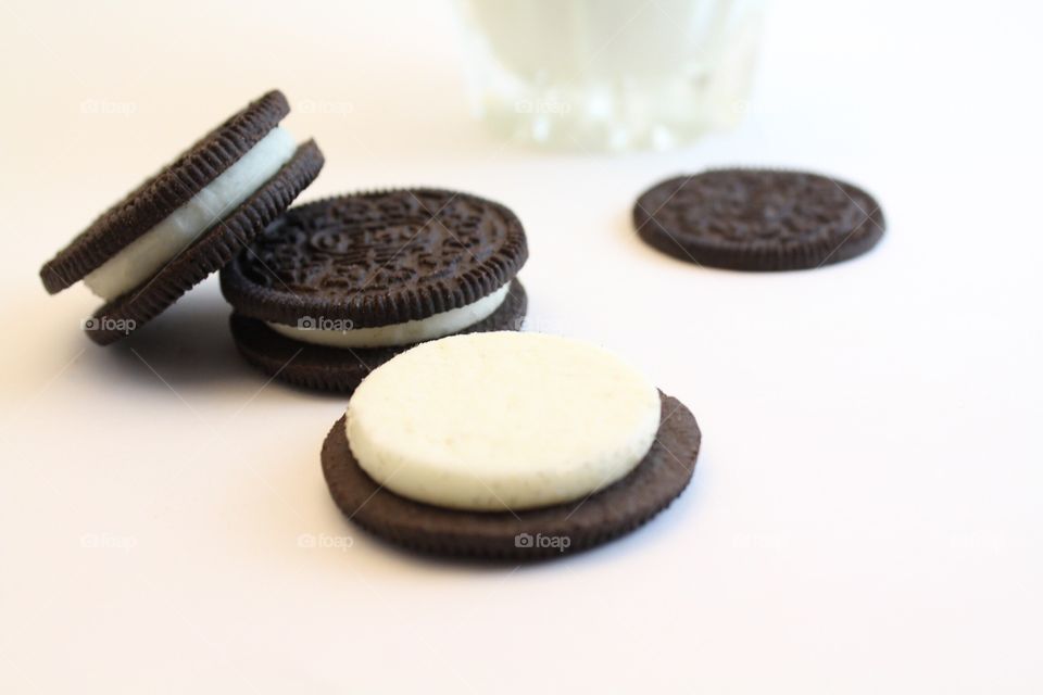 Three oreos with milk