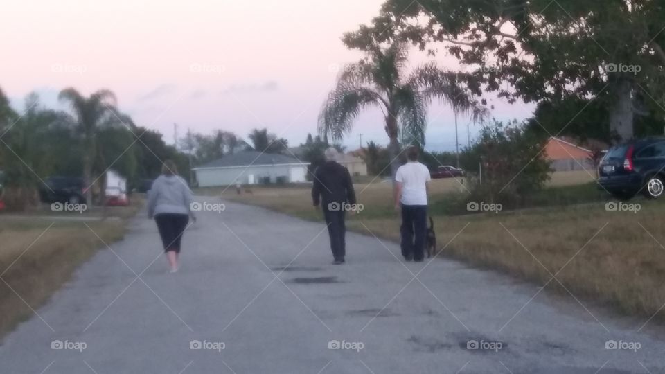 family walking their 🐕