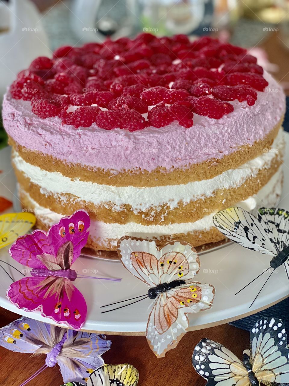 yellow Easter cake, birthday cake, bunny cake, chocolate bunnies, chocolate eggs, colored eggs, Easter eggs, colorful eggs, flowers on the cake, good Easter, raspberry cream cake