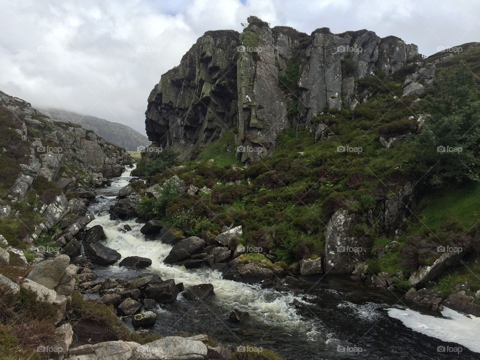 Faces in the rocks watching over the river. 