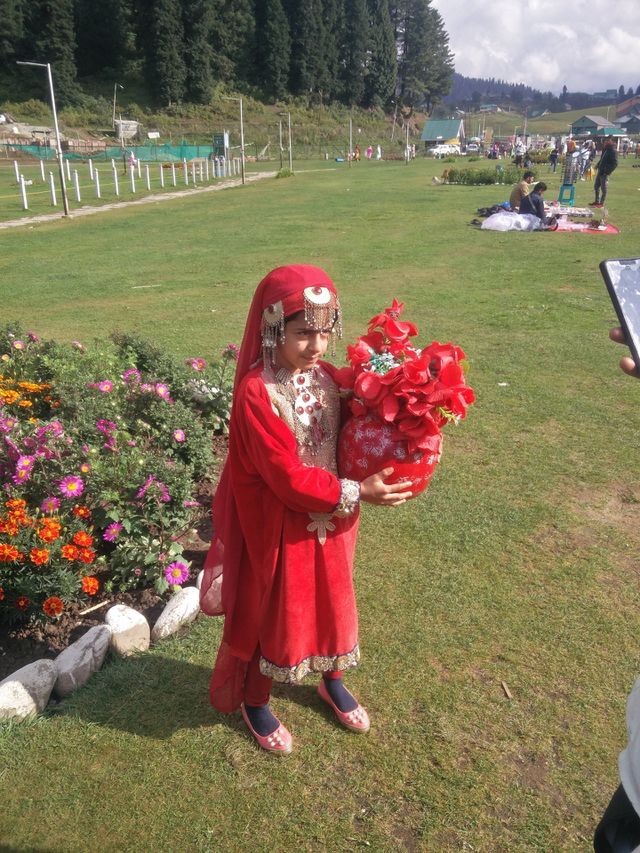 Red little cute girl 😎 cool and fresh environment 
natural beauty at its best..
📸 Muneeb bhat
