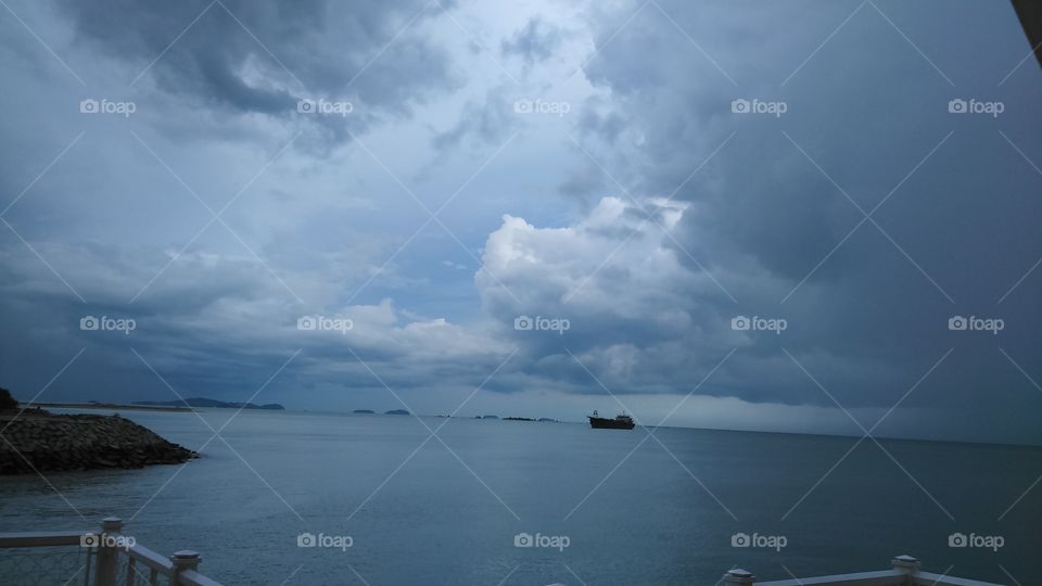Distant view of ship sailing in sea