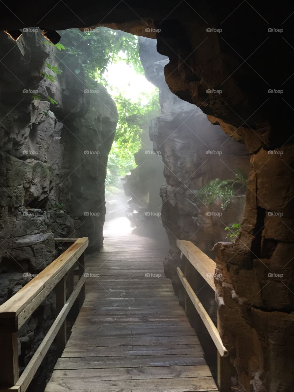 Light at the end of the tunnel. Bridge thru a cave