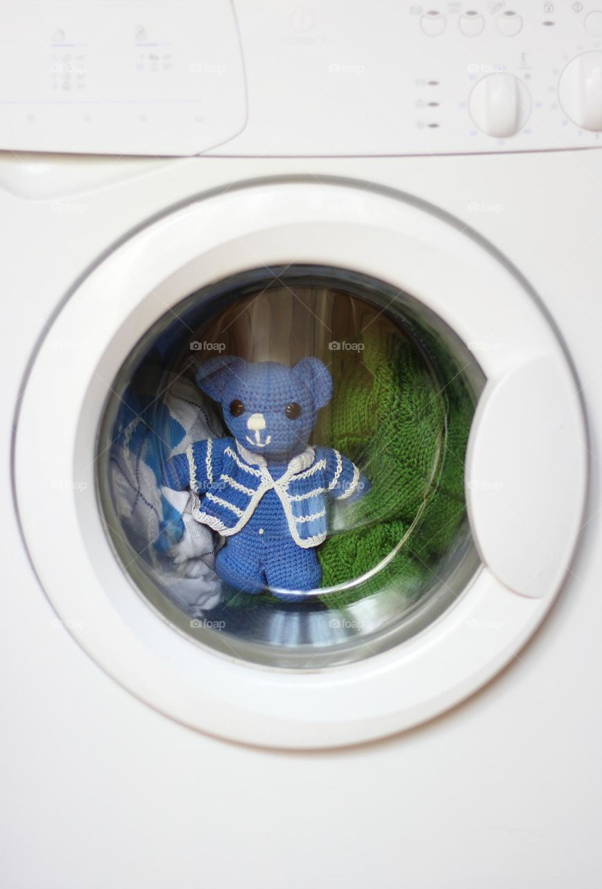 Teddy bear toy in the washing machine