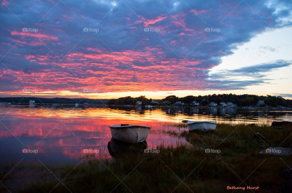 no need to be blue. a vibrant pink and blue sunset is a perfect backdrip for the boats on the water