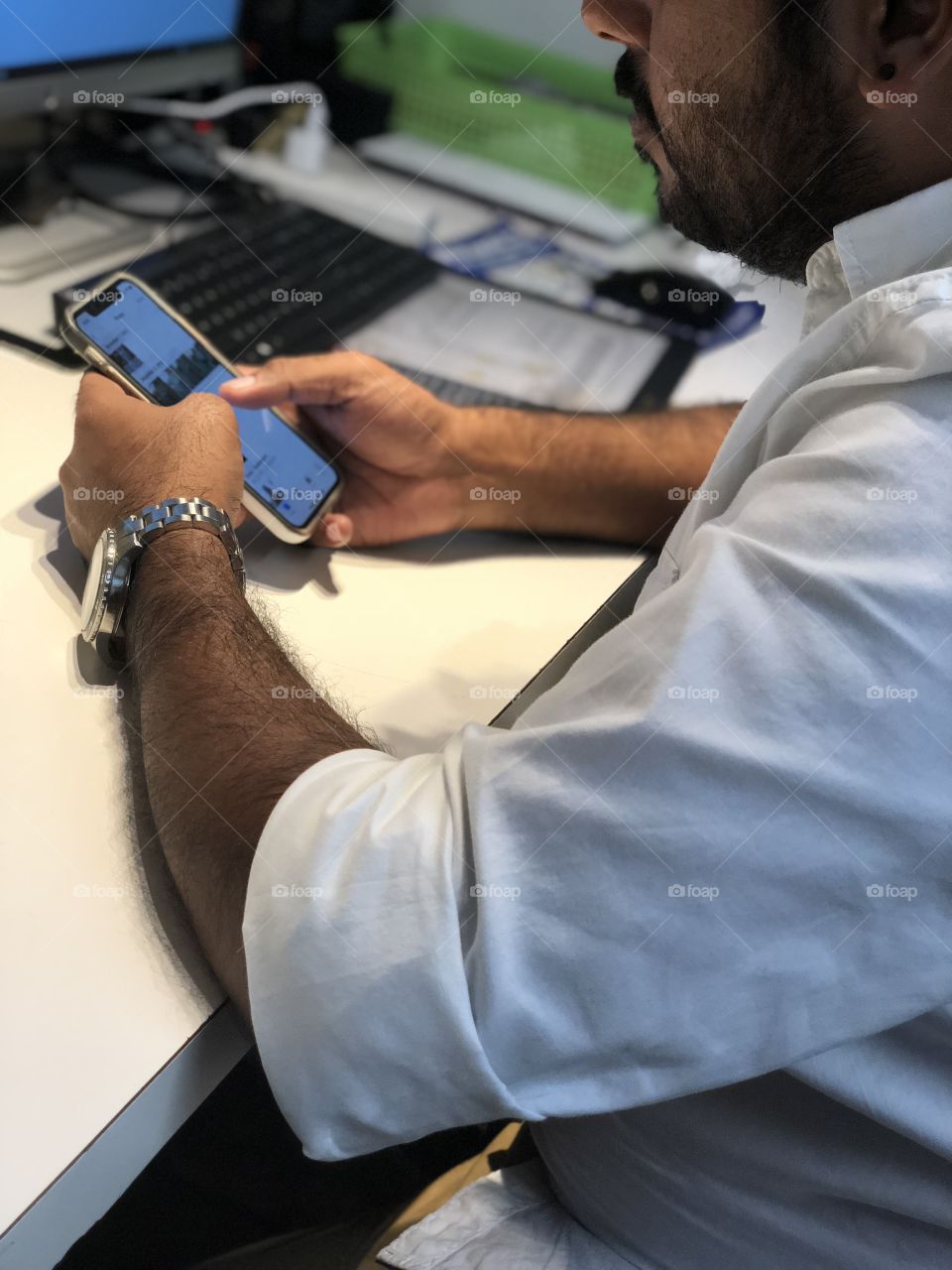 Man working from phone wearing a nice watch