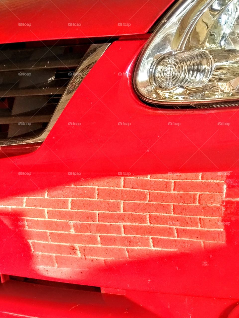 Brick reflection on car