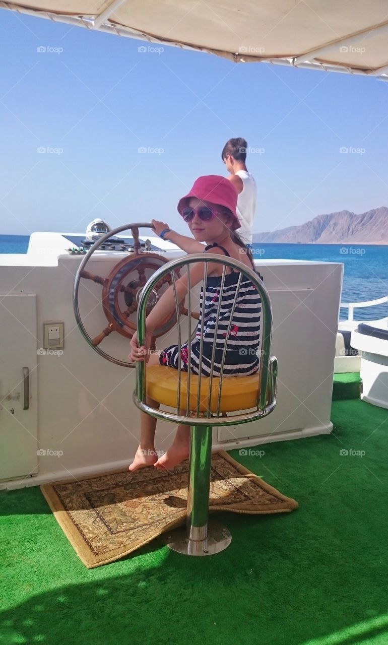 Two child enjoying in boat