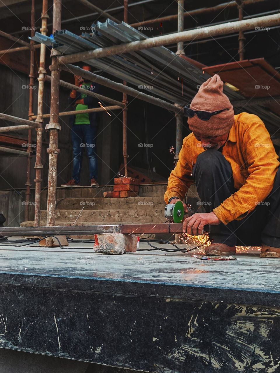 a worker working at a building