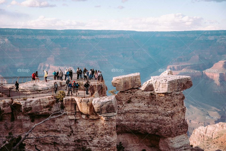 People standing at the edge of cliff grand canyon