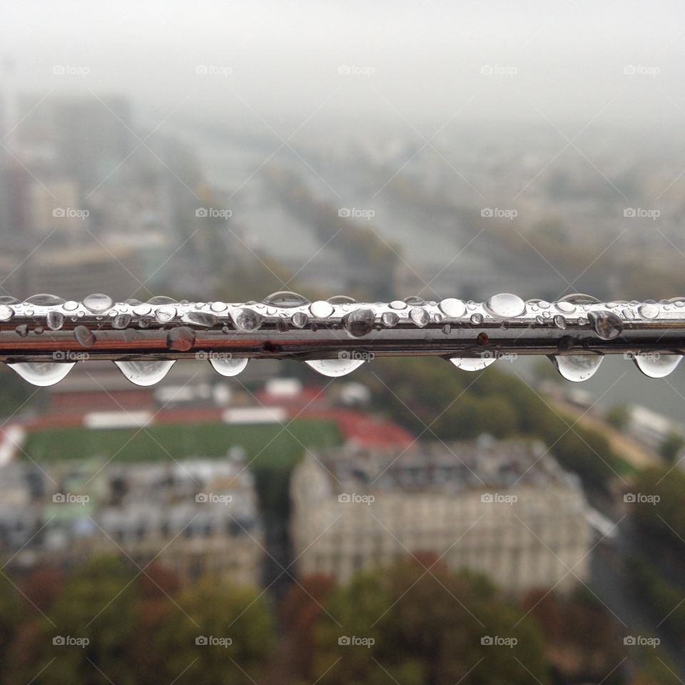 Discovering Paris. A view from Eiffel Tower in the rain 