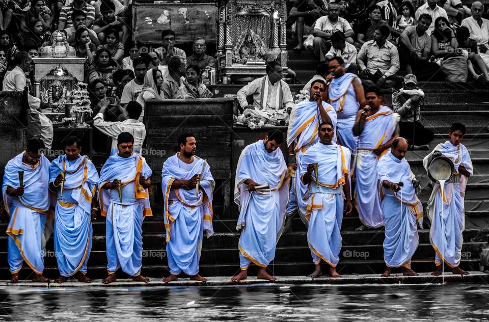 Indian priests performing evening puja or Sandhya aarti at the banks of holy river Ganga in Haridwar, Uttarakhand