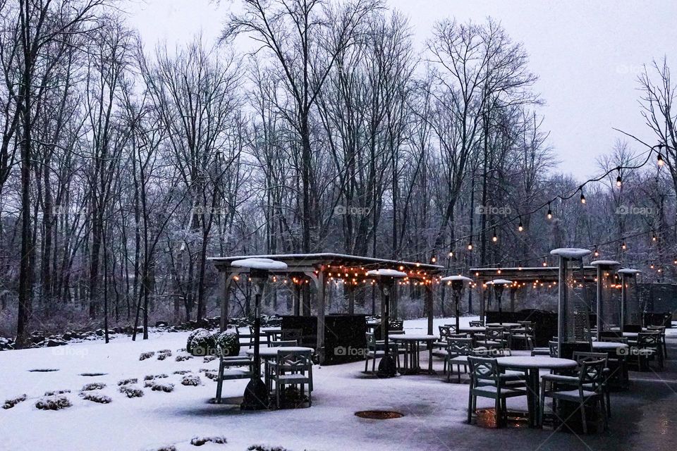 Small lights nicely contrast with the rest of a snowy scene