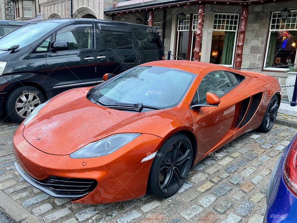 A classy orange McLaren 720S maybe ?!?!  correct me if my Google search in wrong 😂