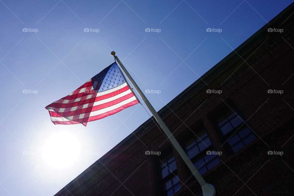American flag, blue sky