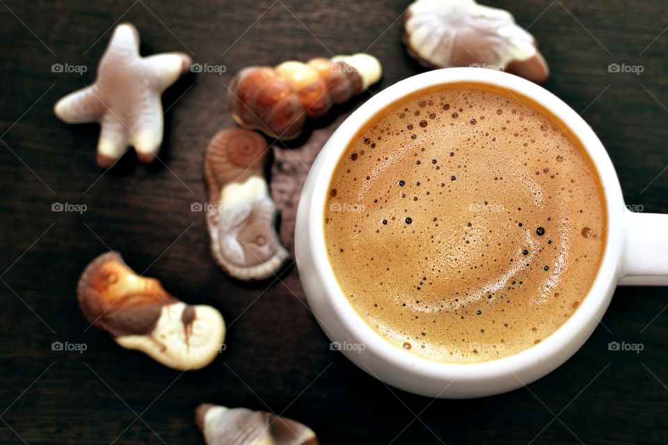 Coffee cup with chocolates