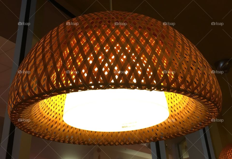 Lamp in a basket. This lamp is hanging over dinning table in a restaurant. Notice it after going to the restaurant a few times. 