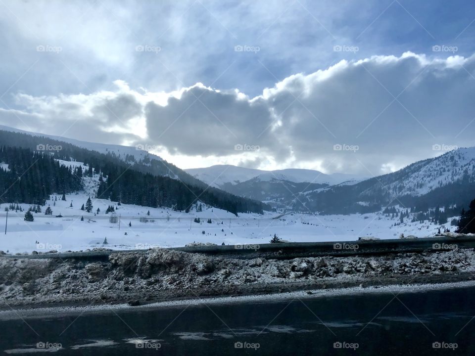 Traveling through the snow covered mountains.