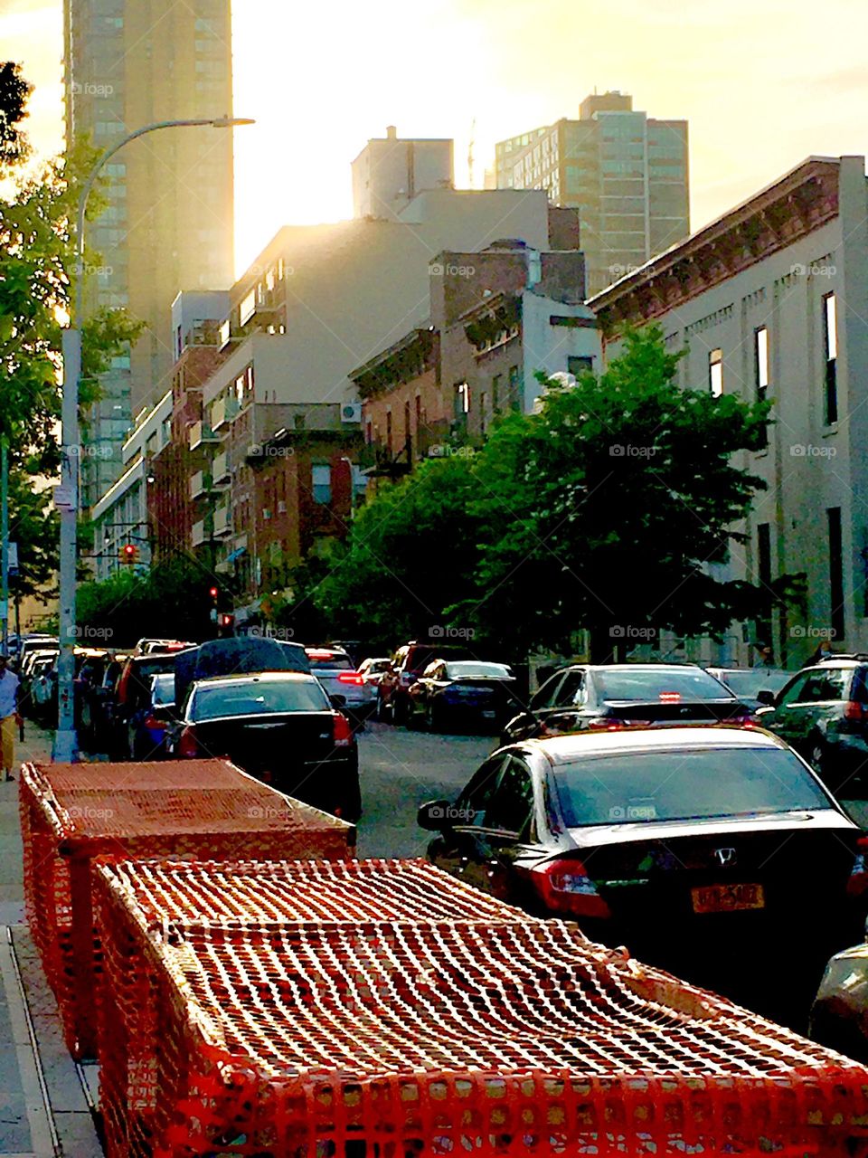 48th Street in LIC, Queens, NY on a Spring time afternoon in 2020. As the sun sets its golden glow becomes increasingly more intense and reflects off car windows and metallic surfaces. Hypnotic Productions