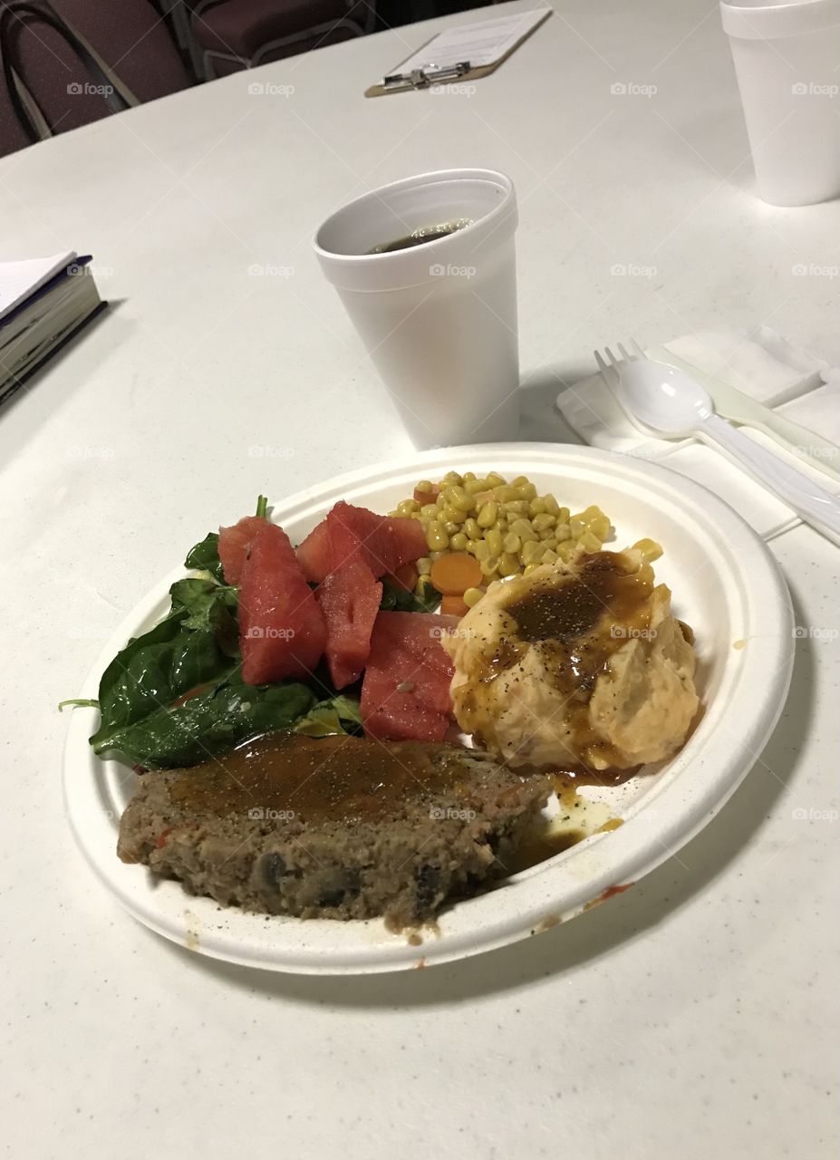 Meatloaf dinner at church. The meatloaf, along with mashed potatoes and gravy and everything else on the plate, looks and tastes mighty good. Let’s not forget about the cup of healthy drink to go with the meal-black coffee.