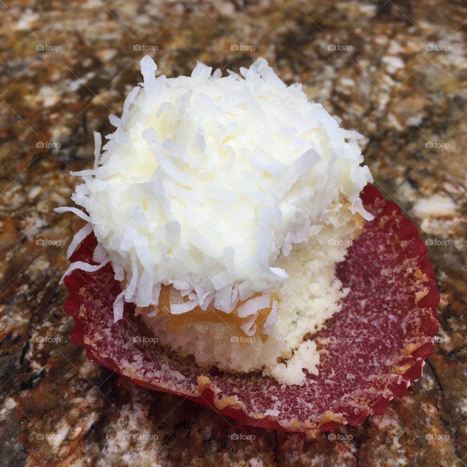 Mini coconut cupcake with bite